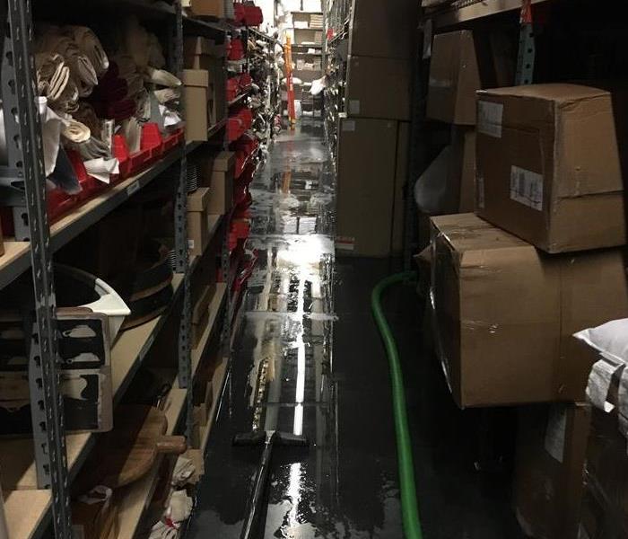 A supply room where a water loss has occurred and extraction has begun.