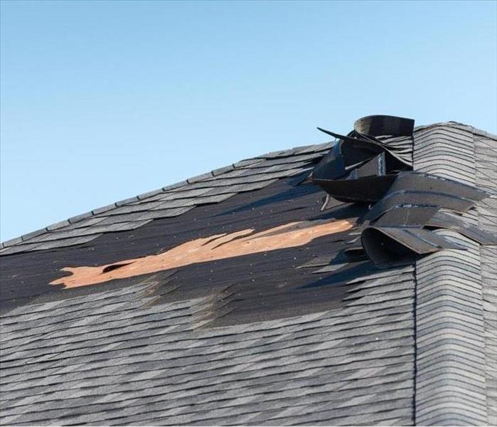 roof shingles falling off of a roof