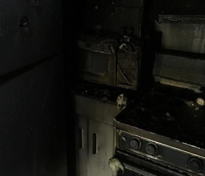An intense fire caused soot to cover everything and melt appliances